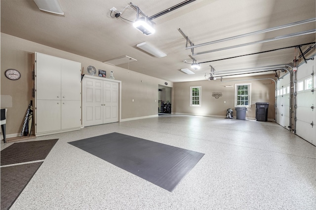 5 Granada Ln, Hot Springs Village, AR 71909 - garage featuring a garage door opener and baseboards