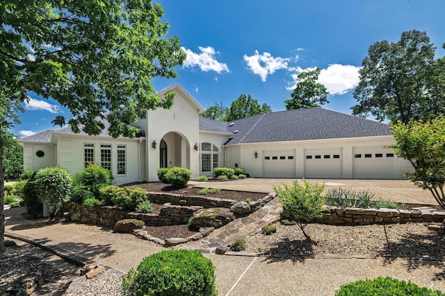 5 Granada Ln, Hot Springs Village, AR 71909 - view of front facade featuring a garage, driveway, and stucco siding