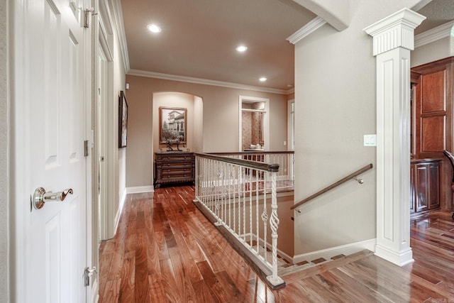 5 Granada Ln, Hot Springs Village, AR 71909 - corridor featuring an upstairs landing, arched walkways, crown molding, wood finished floors, and baseboards