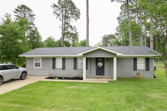 718 Jones St, Sheridan, AR 72150 - ranch-style home featuring brick siding, a front yard, and roof with shingles