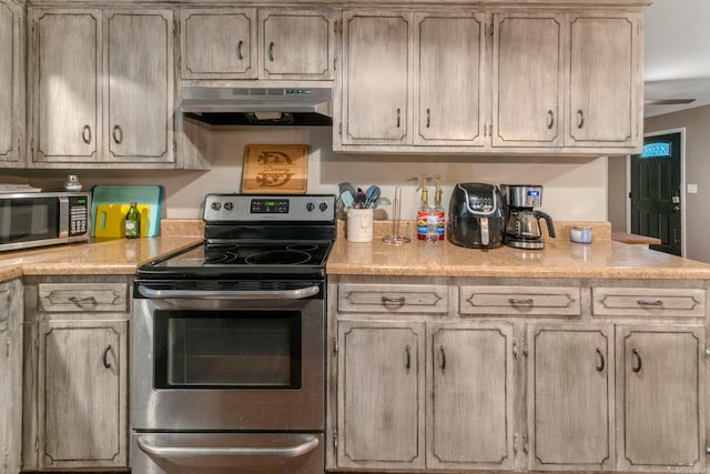 718 Jones St, Sheridan, AR 72150 - kitchen with stainless steel appliances, under cabinet range hood, and light countertops