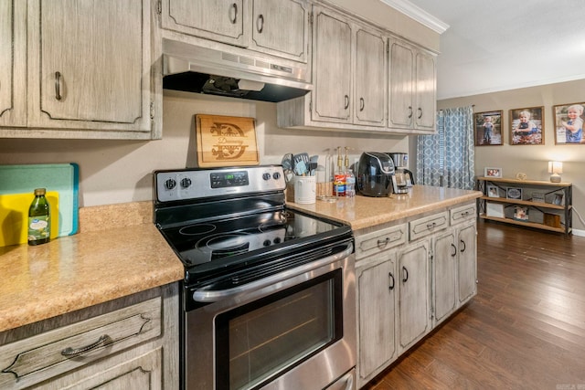 718 Jones St, Sheridan, AR 72150 - kitchen featuring stainless steel electric stove, under cabinet range hood, light countertops, crown molding, and dark wood-style floors