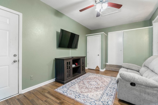 718 Jones St, Sheridan, AR 72150 - living room with wood finished floors, a ceiling fan, and baseboards