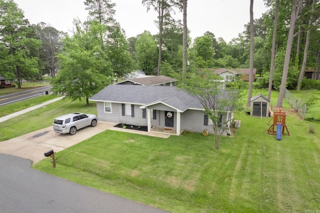 718 Jones St, Sheridan, AR 72150 - view of front of home with roof with shingles, driveway, a front lawn, a storage shed, and an outbuilding