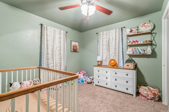 718 Jones St, Sheridan, AR 72150 - bedroom featuring a crib, carpet flooring, and a ceiling fan