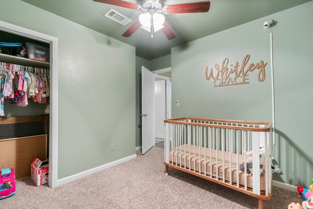 718 Jones St, Sheridan, AR 72150 - carpeted bedroom featuring a nursery area, baseboards, ceiling fan, and a closet