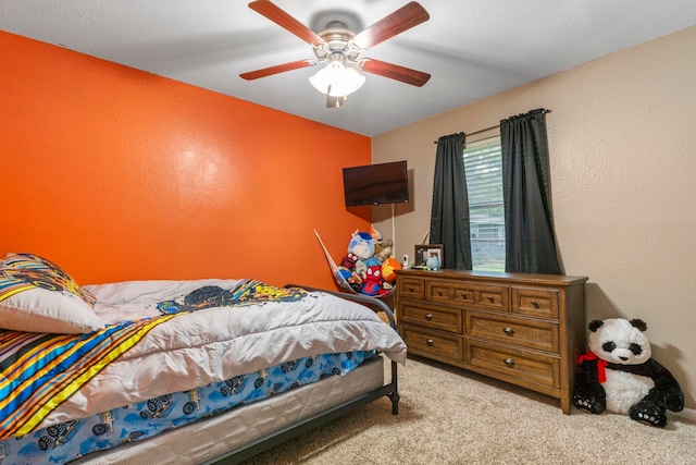 718 Jones St, Sheridan, AR 72150 - carpeted bedroom with a textured wall and a ceiling fan