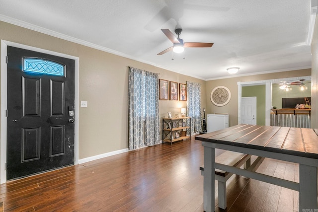 718 Jones St, Sheridan, AR 72150 - entrance foyer featuring ceiling fan, crown molding, wood finished floors, and baseboards