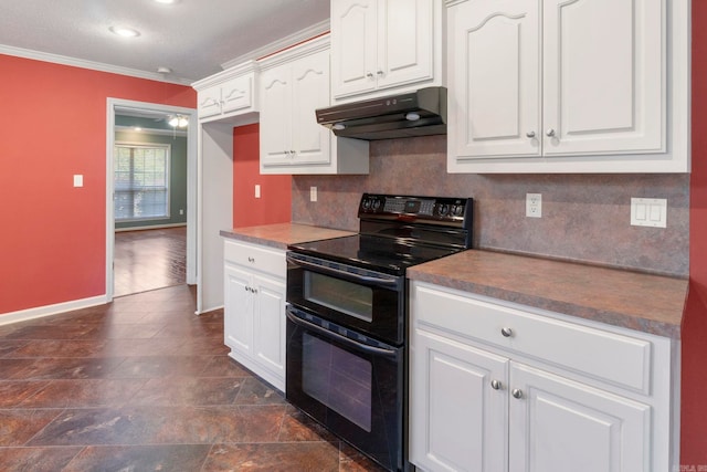 kitchen featuring under cabinet range hood, double oven range, ornamental molding, backsplash, and white cabinetry