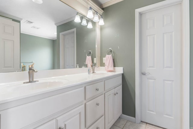 bathroom featuring crown molding, tile patterned floors, double vanity, and baseboards