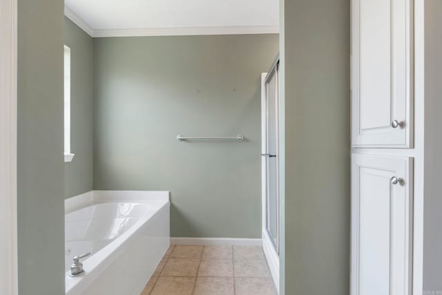 full bathroom with a bath, a stall shower, tile patterned flooring, ornamental molding, and baseboards