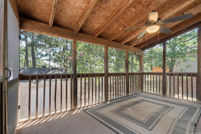 unfurnished sunroom featuring ceiling fan and healthy amount of natural light