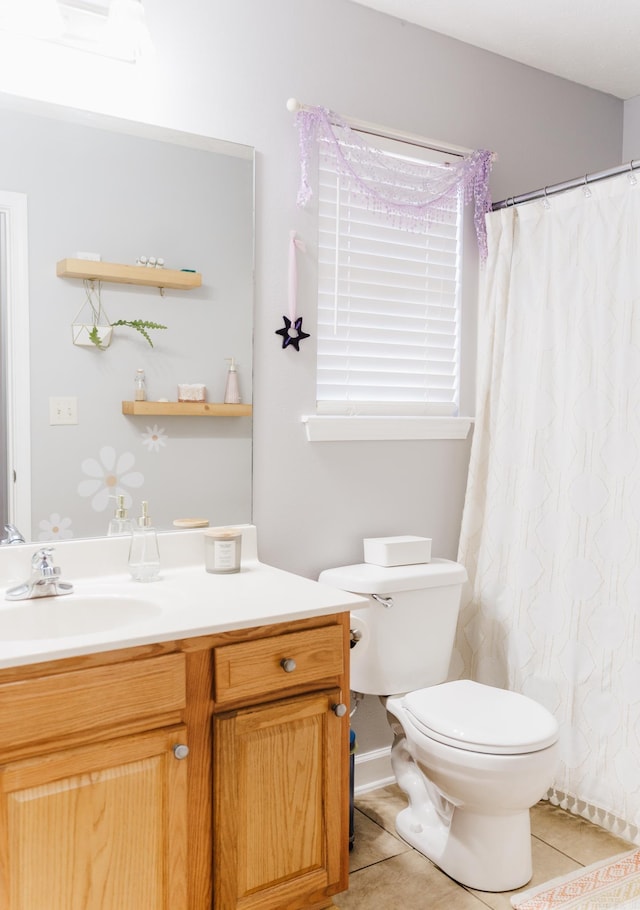 full bath featuring tile patterned floors, toilet, vanity, and a shower with curtain