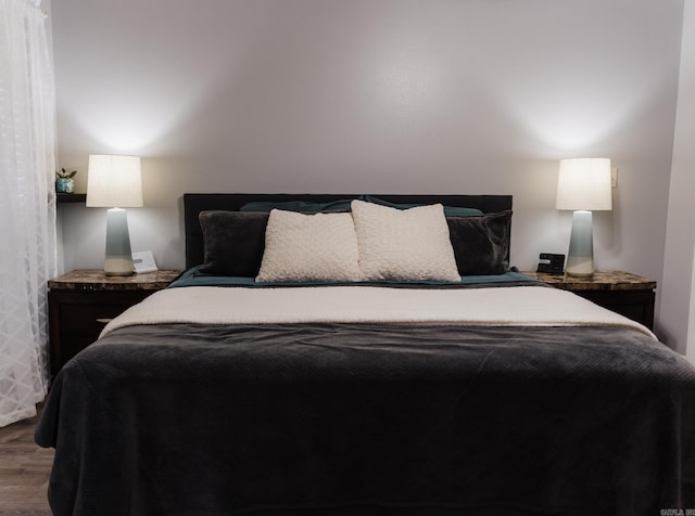 bedroom with wood finished floors