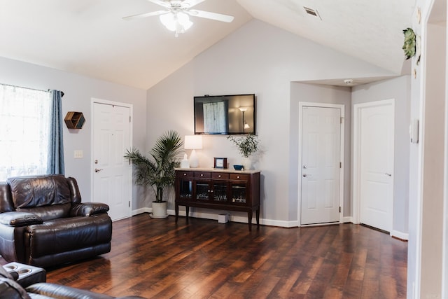 living area with a ceiling fan, dark wood finished floors, high vaulted ceiling, and baseboards