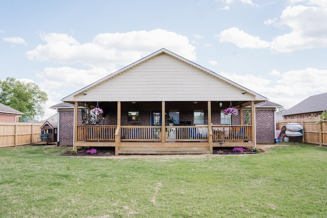 back of house with brick siding and a deck