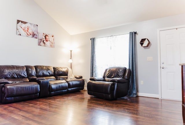 living area with vaulted ceiling, dark wood finished floors, and baseboards