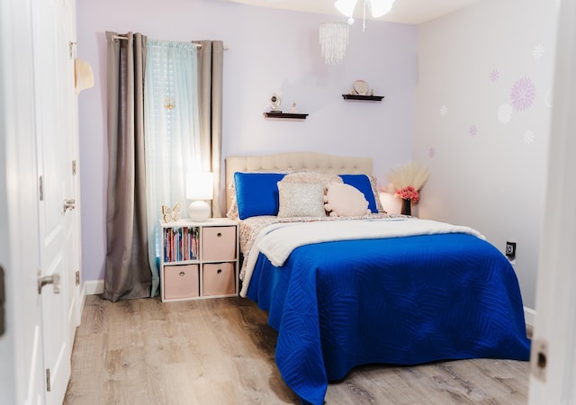 bedroom featuring wood finished floors