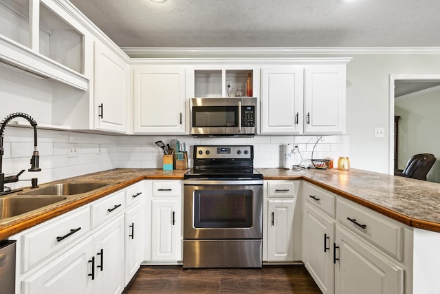 12 High Plains Dr, Cabot, AR 72023 - kitchen featuring stainless steel appliances, open shelves, a sink, ornamental molding, and tasteful backsplash
