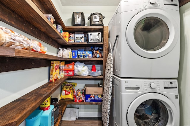 12 High Plains Dr, Cabot, AR 72023 - washroom with stacked washing machine and dryer and wood finished floors