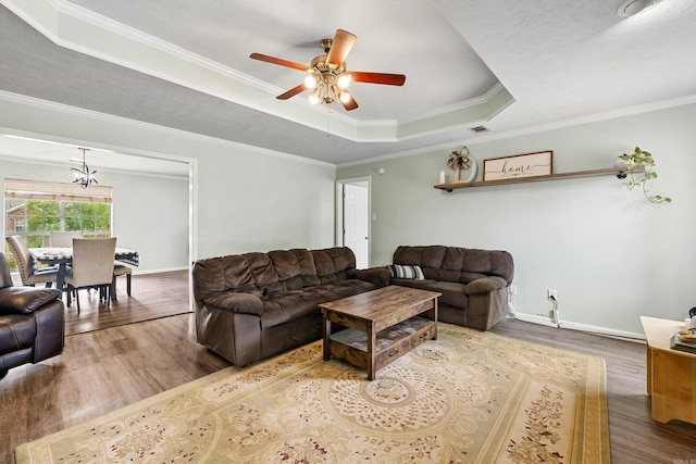 12 High Plains Dr, Cabot, AR 72023 - living room featuring a tray ceiling, wood finished floors, a ceiling fan, ornamental molding, and baseboards
