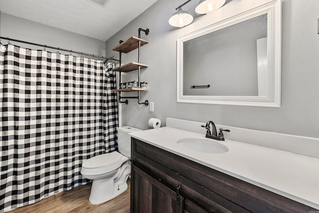 12 High Plains Dr, Cabot, AR 72023 - bathroom featuring toilet, wood finished floors, vanity, and a shower with curtain