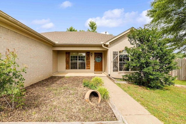 12 High Plains Dr, Cabot, AR 72023 - property entrance featuring roof with shingles and brick siding