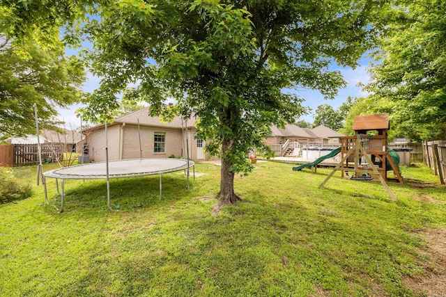 12 High Plains Dr, Cabot, AR 72023 - view of yard with a trampoline and a playground