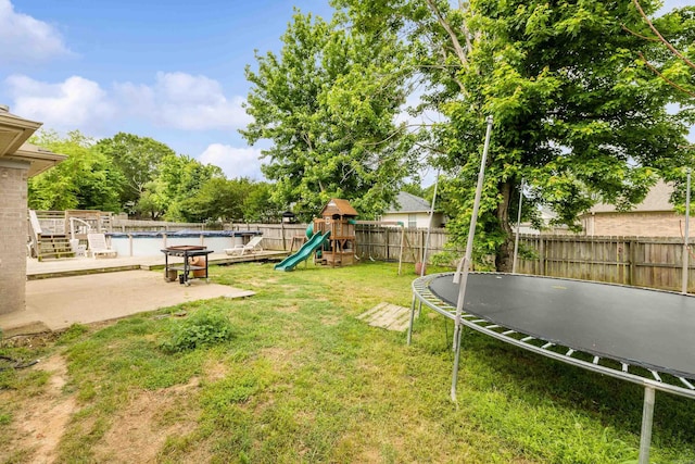 12 High Plains Dr, Cabot, AR 72023 - view of yard with a trampoline and a playground