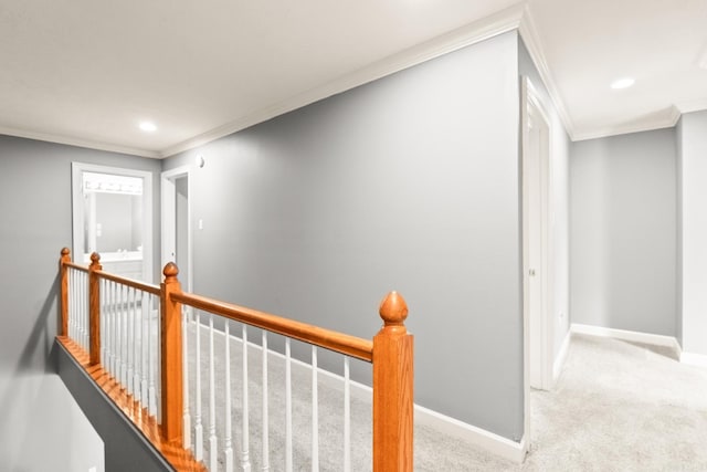 hallway featuring an upstairs landing, ornamental molding, carpet, baseboards, and recessed lighting
