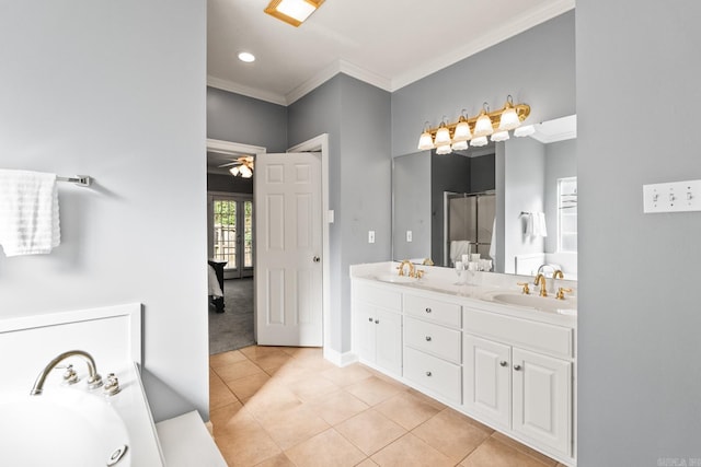 full bath with ornamental molding, tile patterned flooring, a stall shower, double vanity, and a garden tub