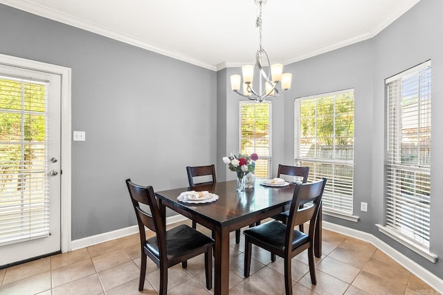 dining room featuring a chandelier, healthy amount of natural light, ornamental molding, and light tile patterned flooring