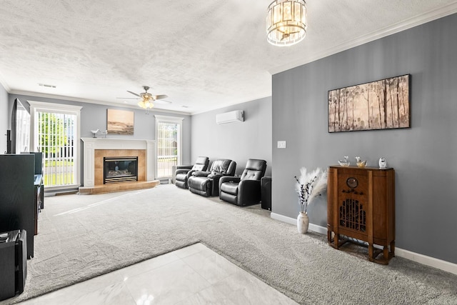 carpeted living room with a wall mounted air conditioner, crown molding, ceiling fan, a tile fireplace, and a textured ceiling