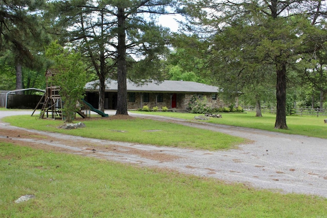 1843 Rocky Point Rd, Judsonia, AR 72081 - single story home featuring a detached carport, driveway, and a playground