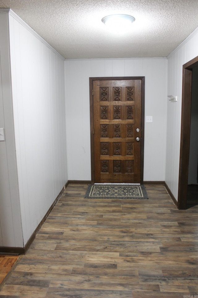 1843 Rocky Point Rd, Judsonia, AR 72081 - entrance foyer with a textured ceiling, wood finished floors, baseboards, and crown molding