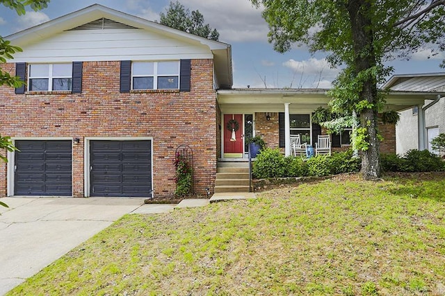 8113 Leatrice Dr, Little Rock, AR 72227 - split level home with brick siding, a front yard, concrete driveway, a garage, and covered porch
