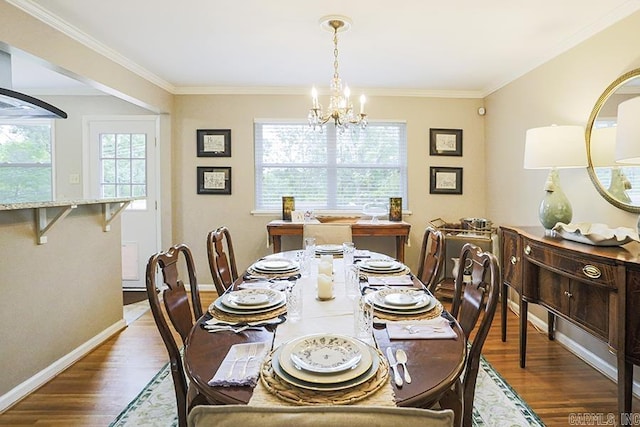 8113 Leatrice Dr, Little Rock, AR 72227 - dining space with a chandelier, dark wood-type flooring, crown molding, and baseboards