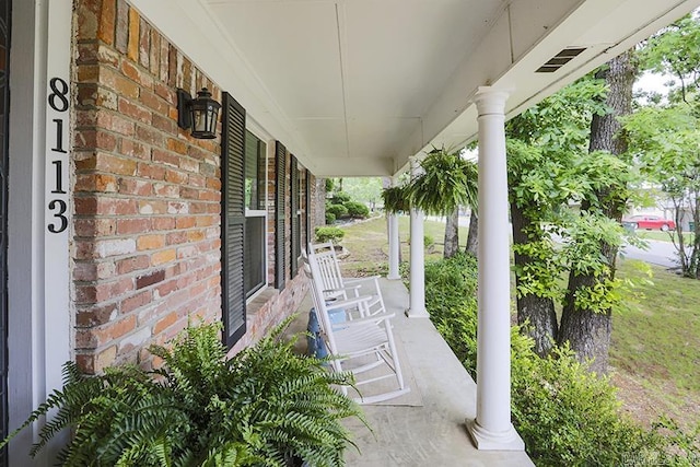 8113 Leatrice Dr, Little Rock, AR 72227 - view of patio featuring a porch