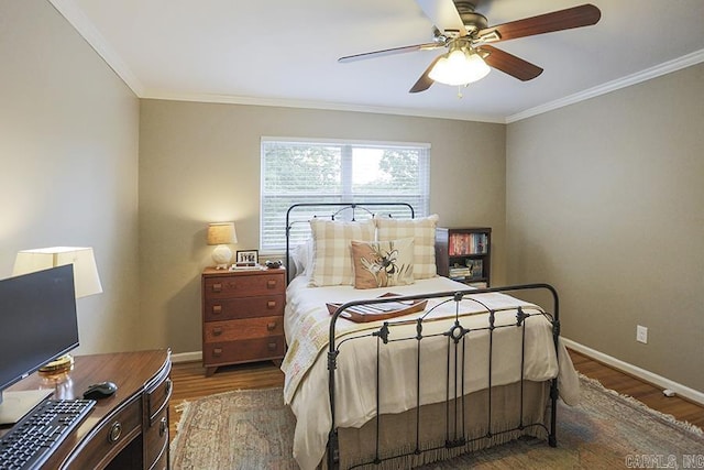 8113 Leatrice Dr, Little Rock, AR 72227 - bedroom with wood finished floors, baseboards, crown molding, an office area, and a ceiling fan