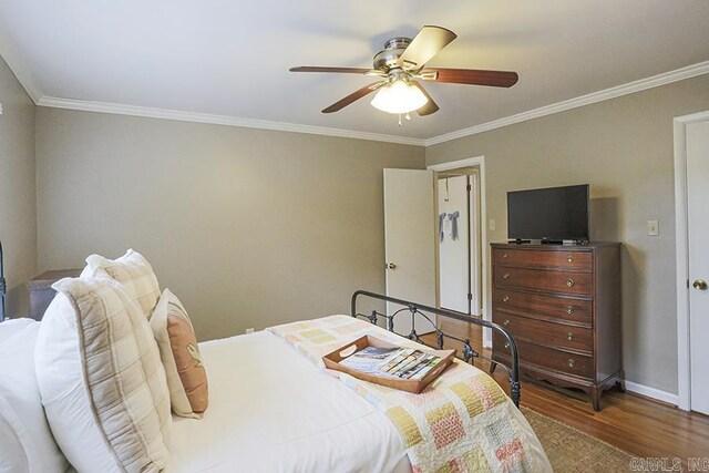8113 Leatrice Dr, Little Rock, AR 72227 - bedroom with wood finished floors, ornamental molding, baseboards, and ceiling fan