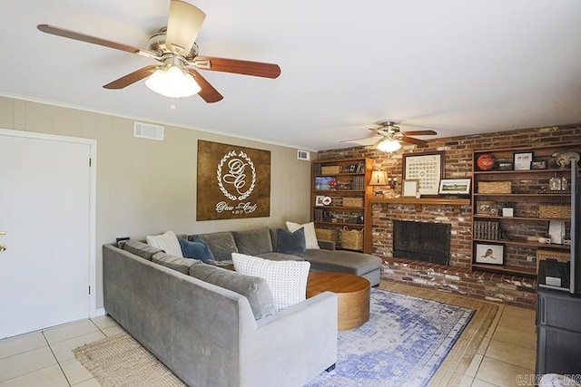 8113 Leatrice Dr, Little Rock, AR 72227 - living area with ceiling fan, light tile patterned floors, a fireplace, and ornamental molding