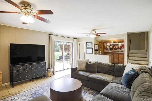 8113 Leatrice Dr, Little Rock, AR 72227 - living area with ceiling fan, light tile patterned flooring, stairs, and bar