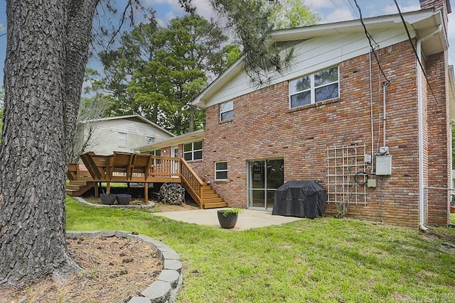 8113 Leatrice Dr, Little Rock, AR 72227 - rear view of property featuring a patio area, brick siding, a deck, a yard, and stairs
