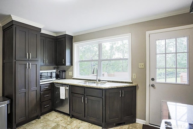 8113 Leatrice Dr, Little Rock, AR 72227 - kitchen with appliances with stainless steel finishes, a sink, plenty of natural light, backsplash, and crown molding
