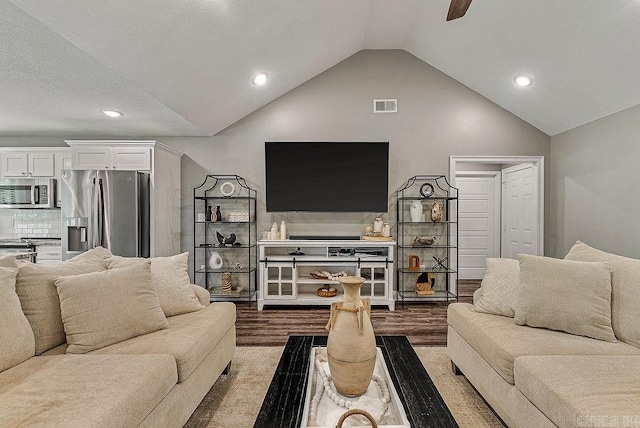 living room with vaulted ceiling, dark wood-style flooring, recessed lighting, and ceiling fan