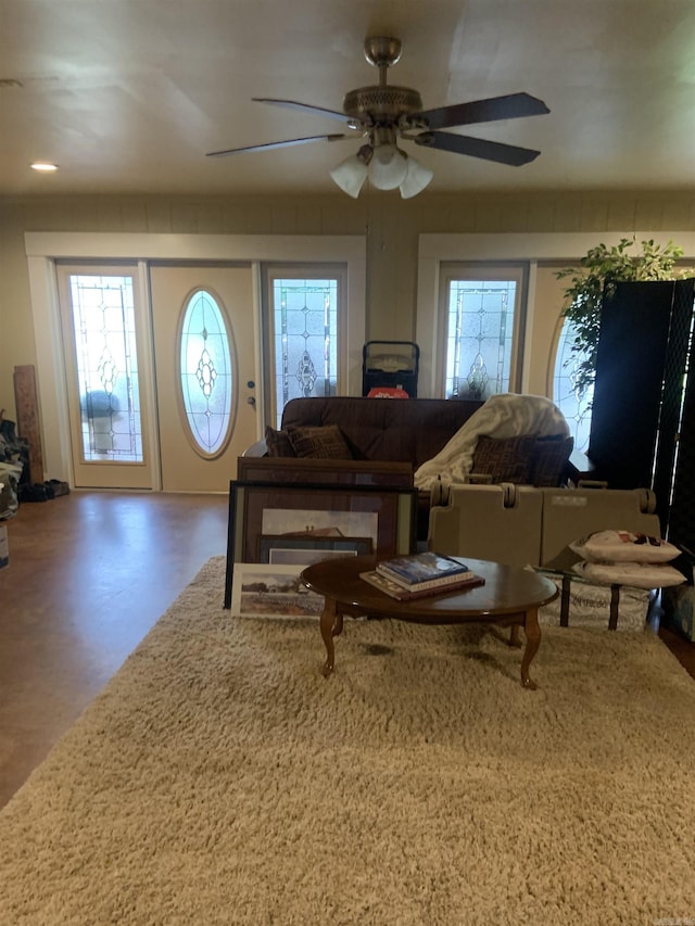 living room featuring ceiling fan and recessed lighting