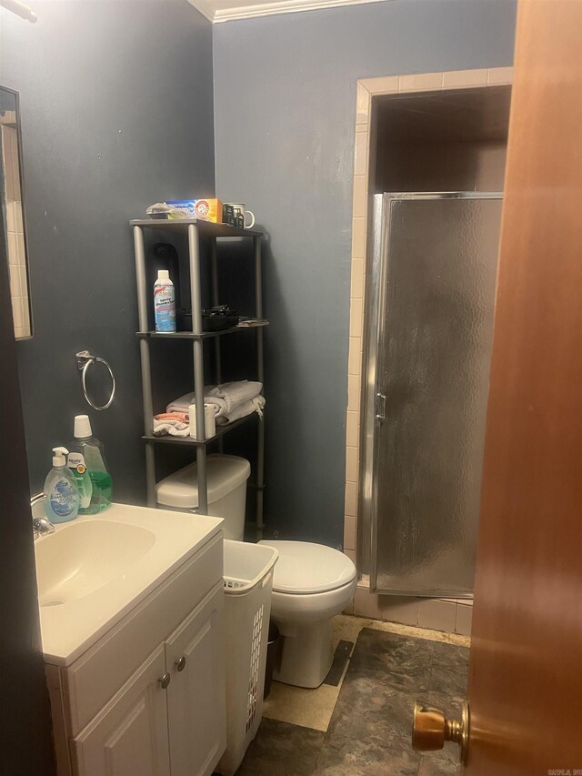 full bathroom with a shower stall, vanity, toilet, and tile patterned floors