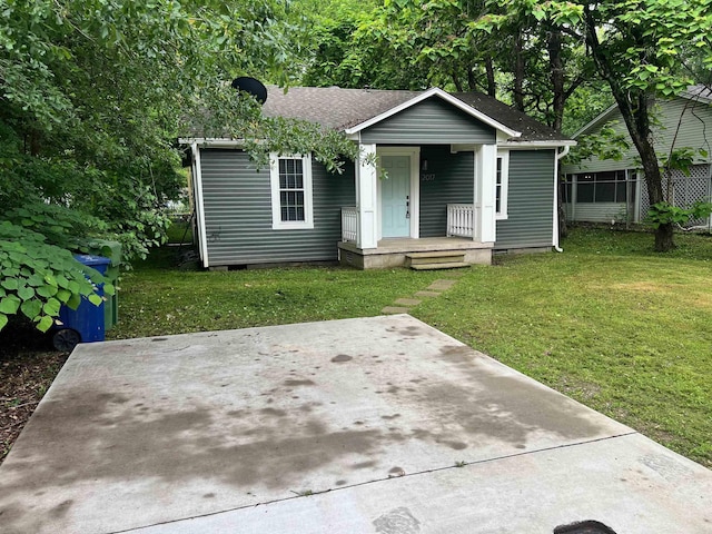 bungalow-style house featuring a front yard, a porch, crawl space, and a shingled roof