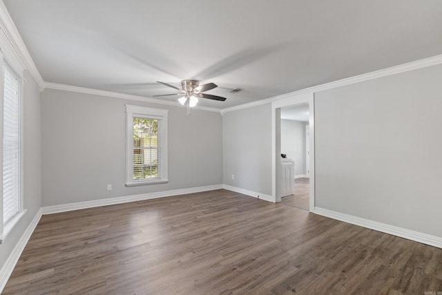 empty room featuring ceiling fan, wood finished floors, baseboards, and ornamental molding