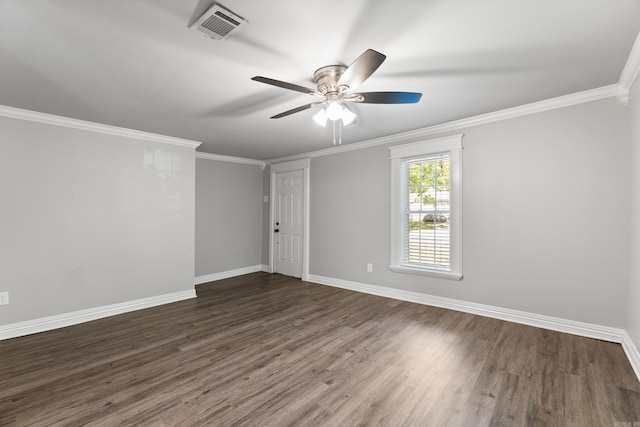 spare room with a ceiling fan, dark wood-style floors, baseboards, and crown molding